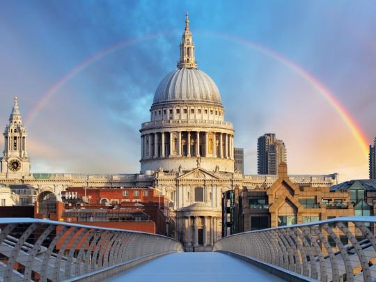 View of St Paul's Cathedral from a bridge with a rainbow over the dome