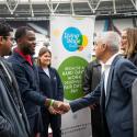 Mayor of London shaking hand with employees at London Living Wage rate announecment 2023, at London Stadium
