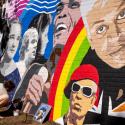 Artist working on a colourful mural showing iconic musicians from Croydon like Nadia Rose and Samuel Coleridge Taylor.   